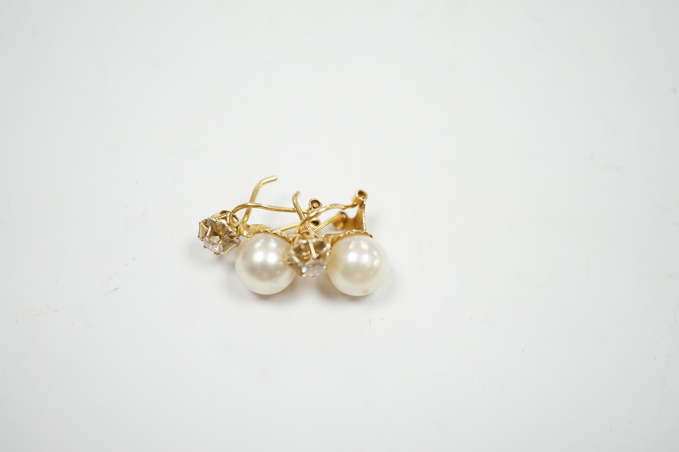 A pair of yellow metal, cultured pearl and simulated diamond set two stone earrings, 15mm, gross weight 4.3 grams.